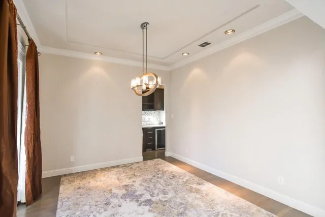 a view of a livingroom with a ceiling fan and window
