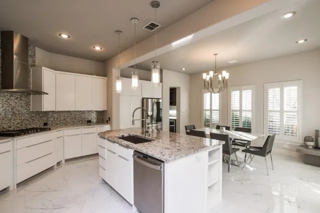 a kitchen with a center island and appliances