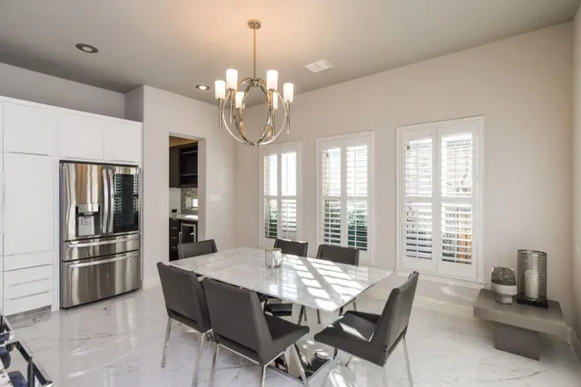 a view of a livingroom with furniture and windows