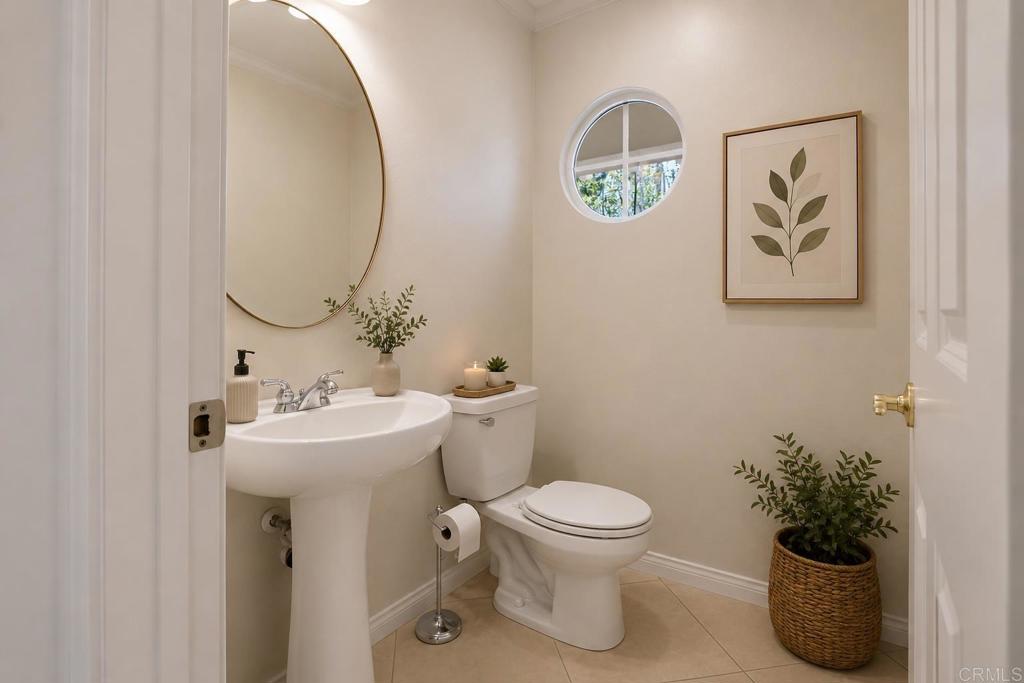 672 Inverlochy Drive Fallbrook, CA 92028 - Photo 28 of 75 a bathroom with a toilet a sink and mirror