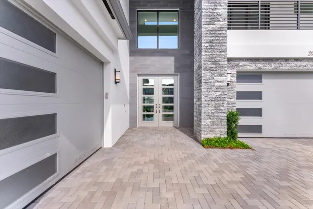a view of an empty room with stairs and a window