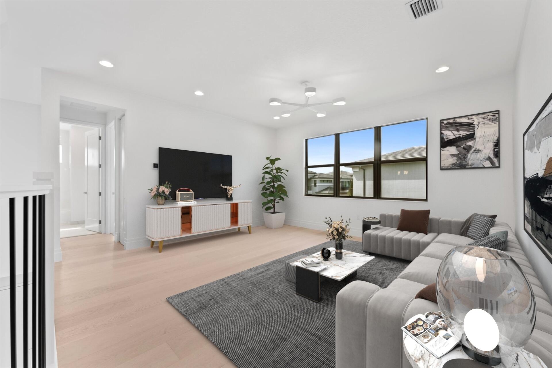 20107 Pacific Dunes Drive Boca Raton, FL 33434 - Photo 34 of 85 a living room with furniture and a flat screen tv