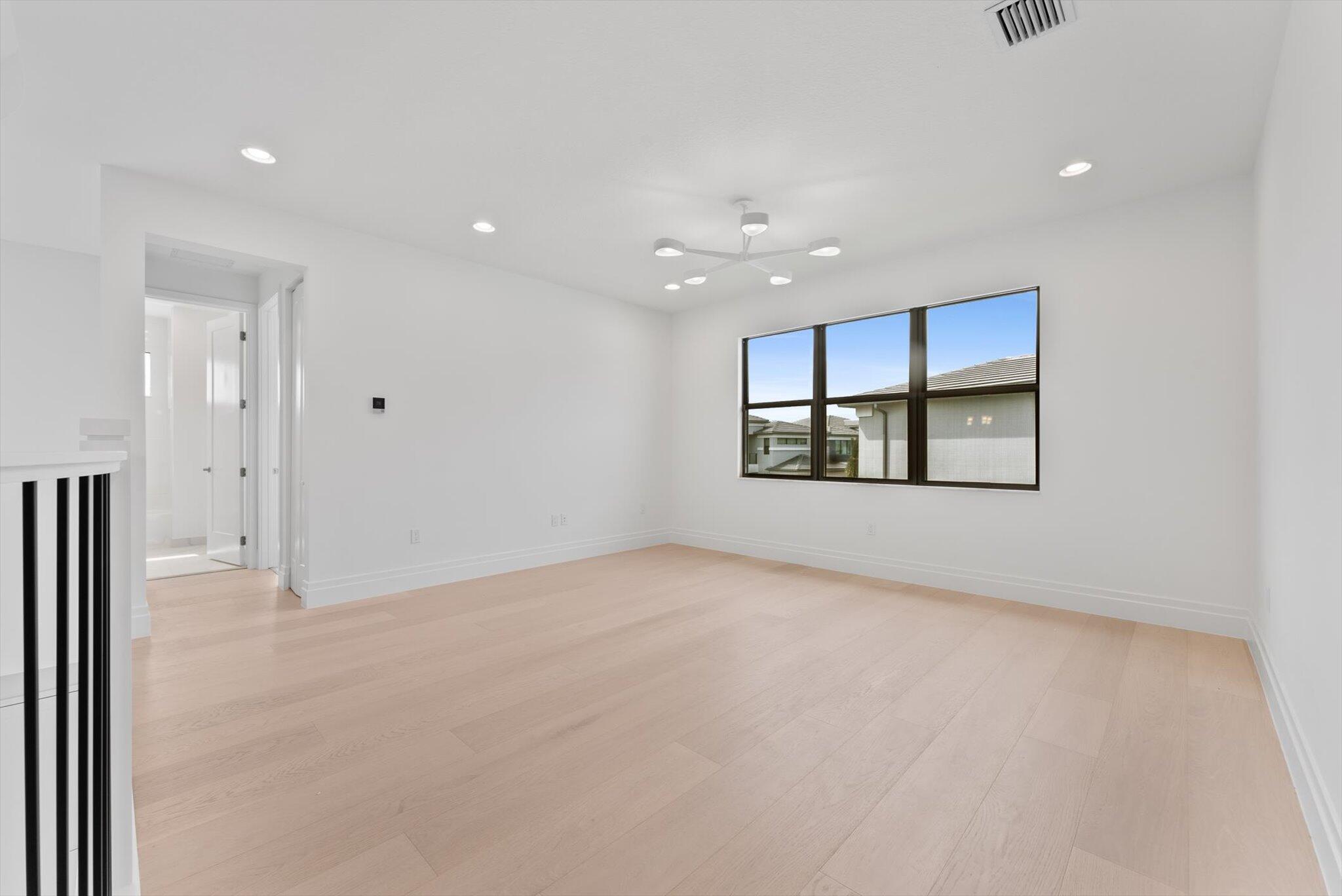 20107 Pacific Dunes Drive Boca Raton, FL 33434 - Photo 35 of 85 a view of an empty room with a window