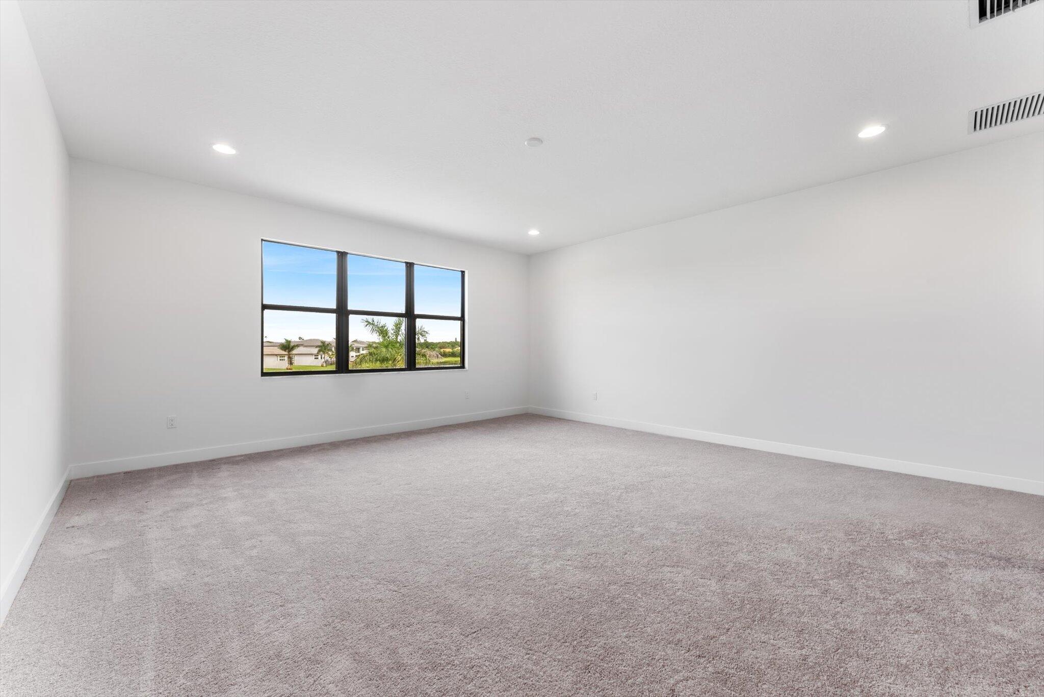 20107 Pacific Dunes Drive Boca Raton, FL 33434 - Photo 38 of 85 an empty room with windows