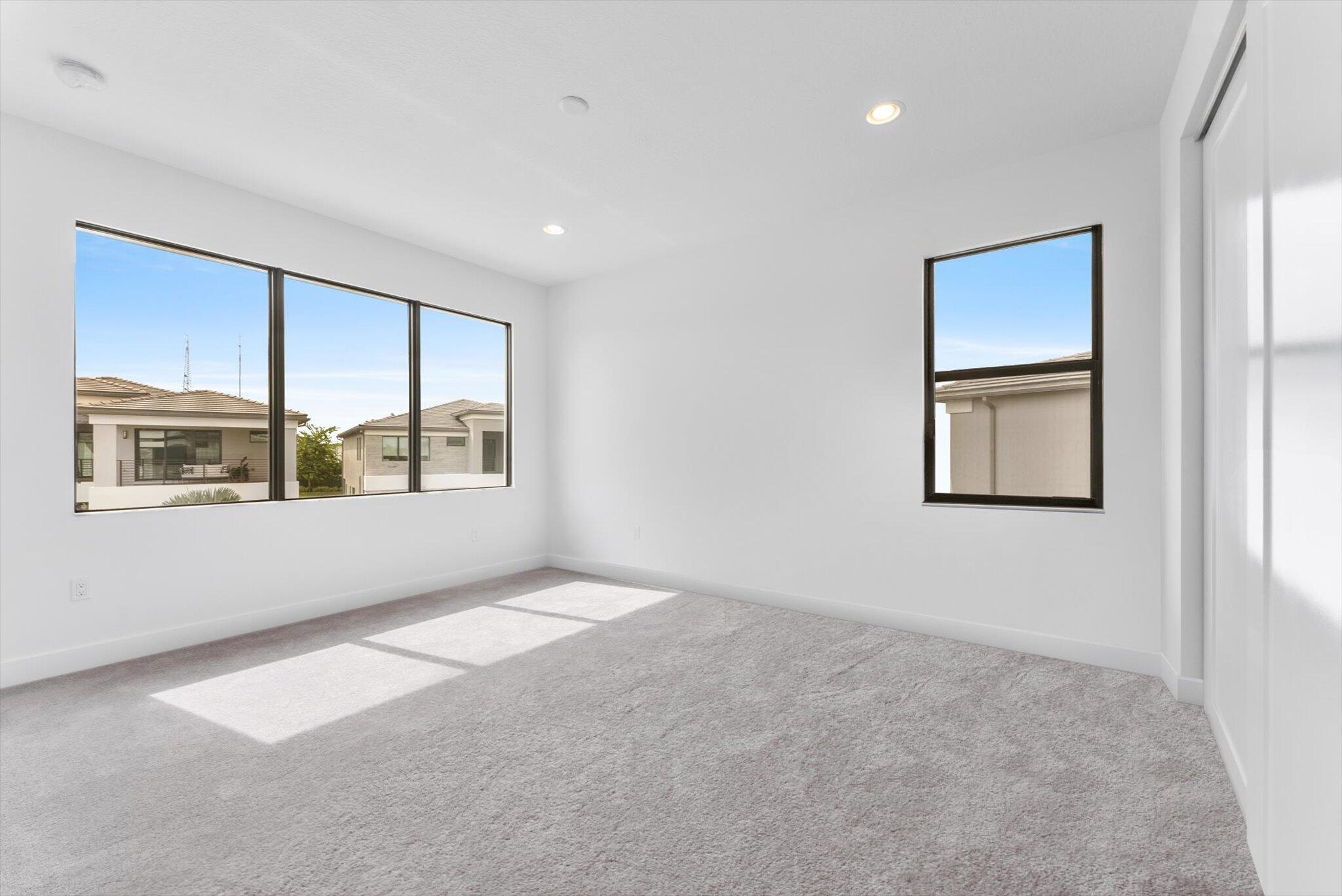20107 Pacific Dunes Drive Boca Raton, FL 33434 - Photo 49 of 85 an empty room with windows and cabinet