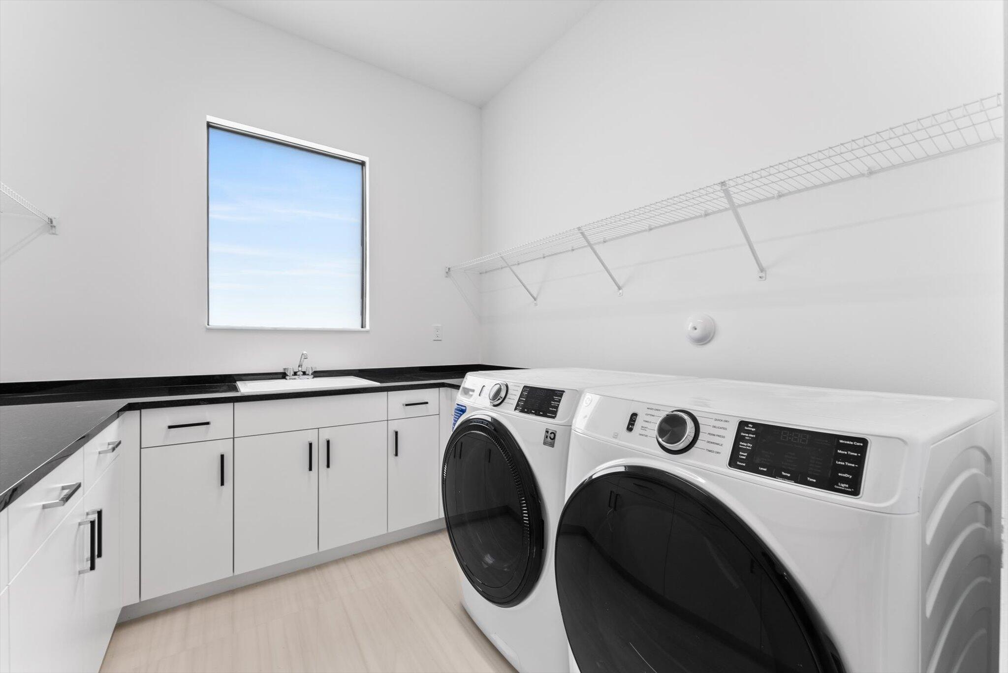 20107 Pacific Dunes Drive Boca Raton, FL 33434 - Photo 51 of 85 a utility room with dryer and washer