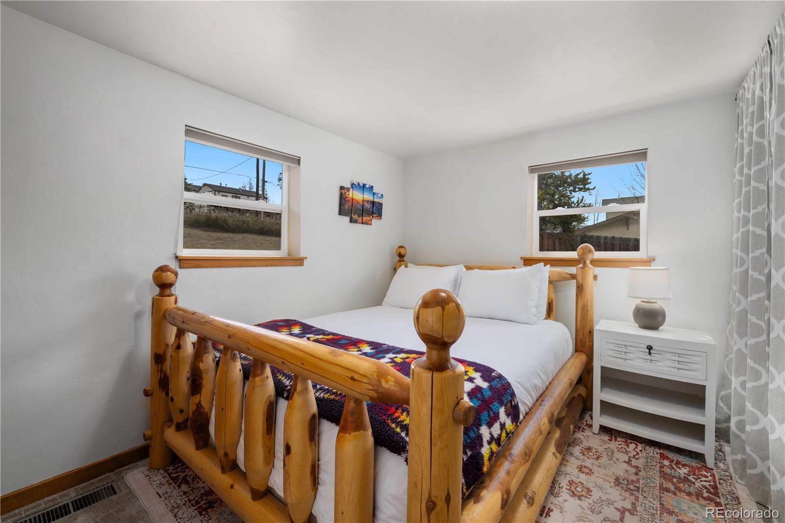 316 Hummingbird Circle Silverthorne, CO 80498 - Photo 14 of 33 a bedroom with furniture and a window