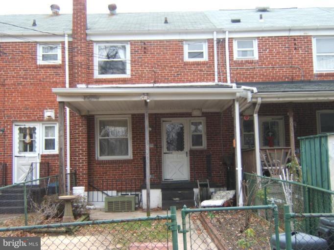 8038 Kavanagh Road Dundalk, MD 21222 - Photo 2 of 10 a front view of a house with a yard