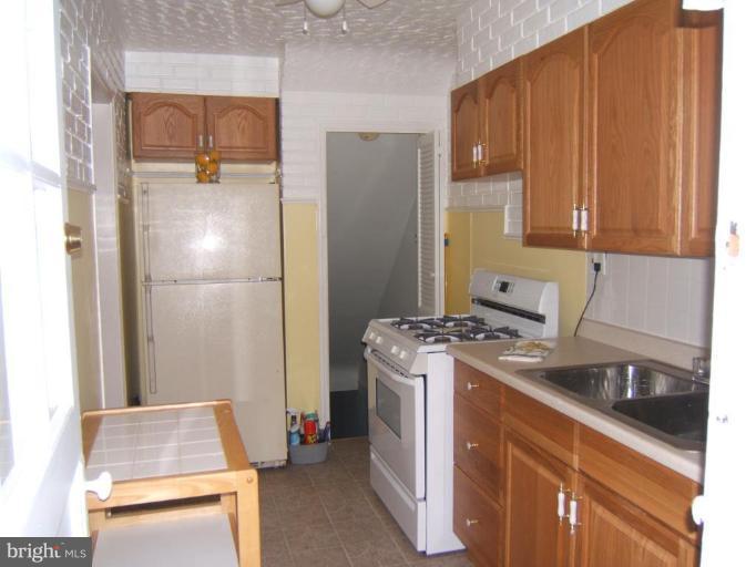 8038 Kavanagh Road Dundalk, MD 21222 - Photo 4 of 10 a room with storage and utility