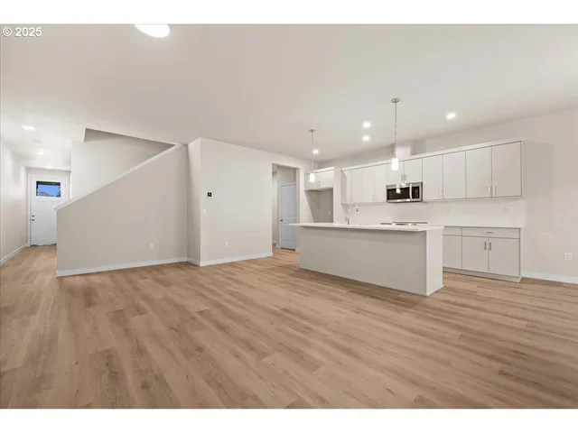 a view of kitchen with wooden floor
