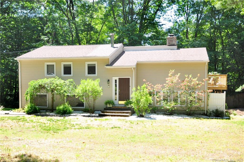 1 Hemlock Road Granby, CT 06035 - Photo 1 of 1 a view of a house with a yard plants and large tree