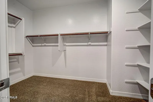 a view of an empty walk in closet