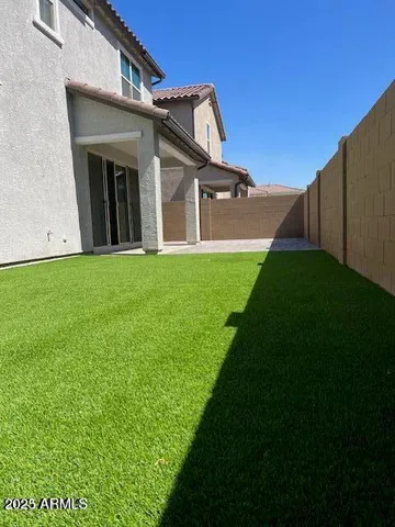 a view of a back yard of the house
