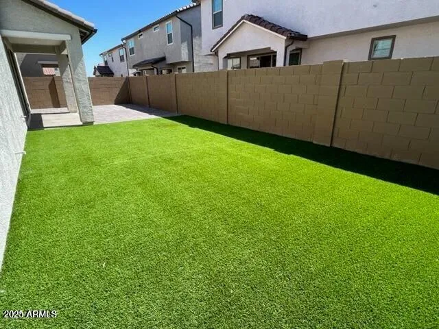 a view of a backyard of the house