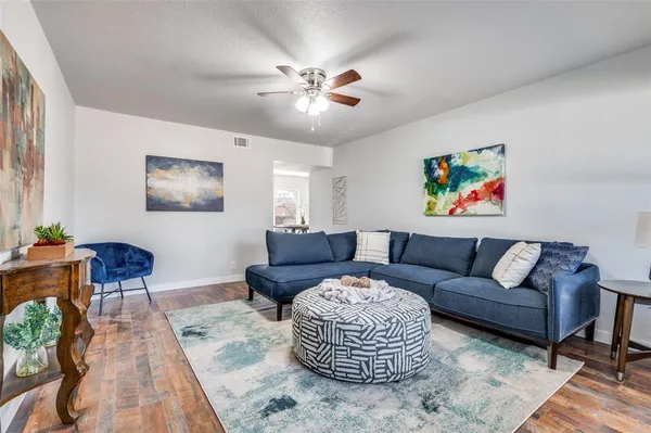 a living room with furniture and a rug