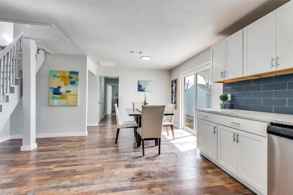 a view of a kitchen and dining room
