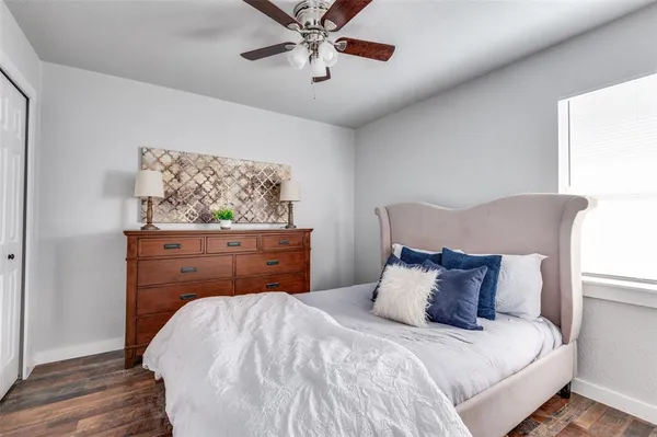 a bedroom with a bed and a dresser
