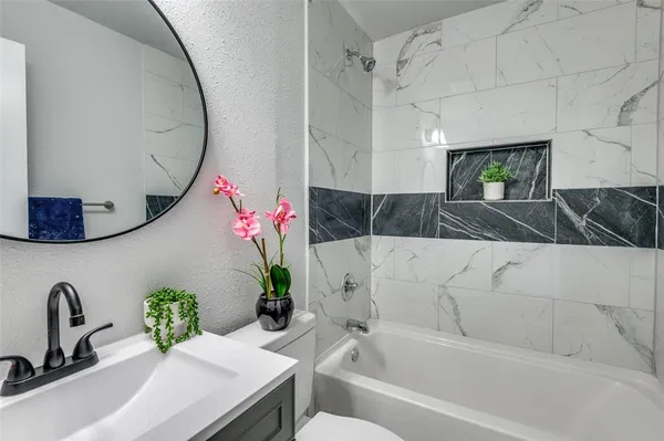a bathroom with a sink and a bathtub