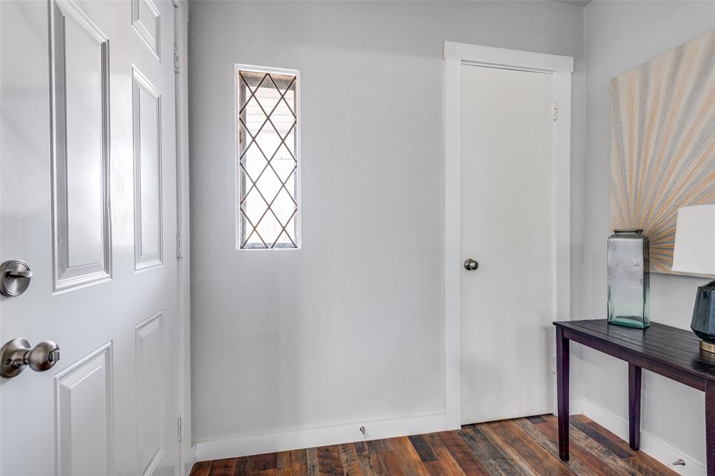 2314 Gilbert Circle Arlington, TX 76010 - Photo 20 of 25 a view of an empty room with a window and wooden floor