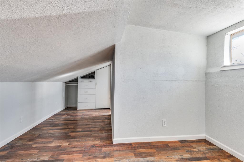 2314 Gilbert Circle Arlington, TX 76010 - Photo 21 of 25 a view of an empty room with wooden floor and a window