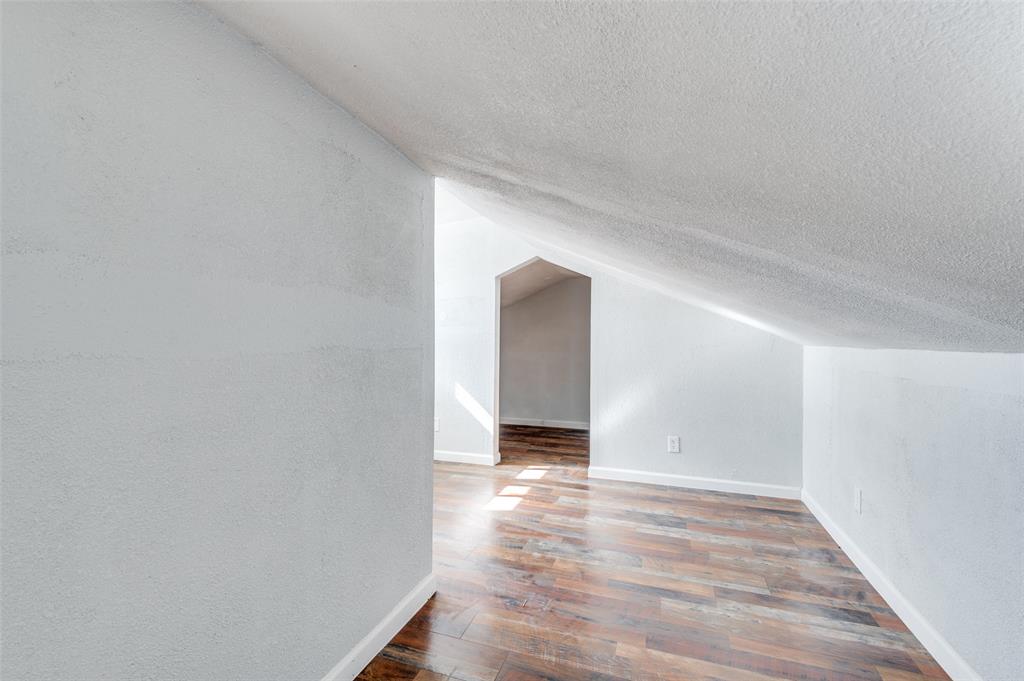 2314 Gilbert Circle Arlington, TX 76010 - Photo 22 of 25 a view of an empty room with wooden floor