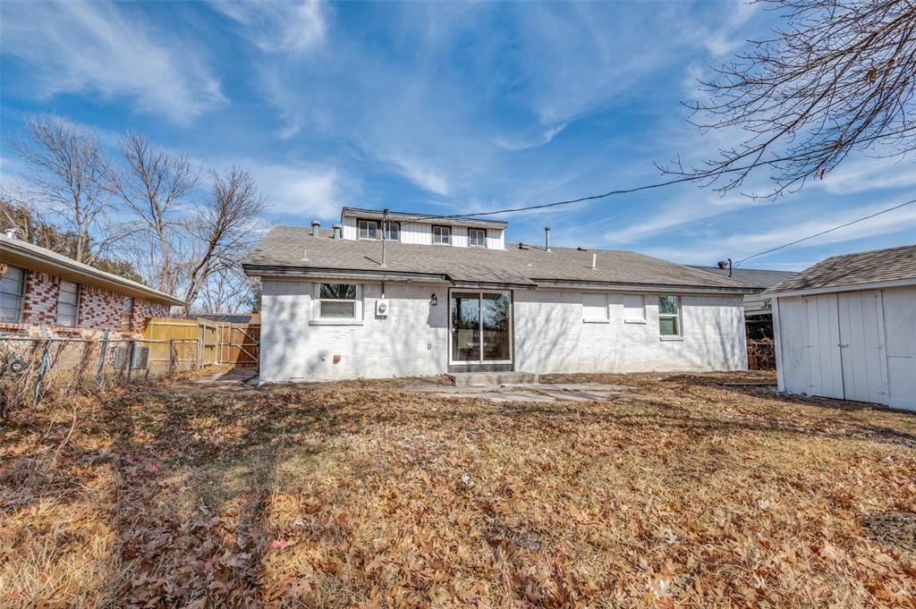 2314 Gilbert Circle Arlington, TX 76010 - Photo 25 of 25 a front view of a house with a yard