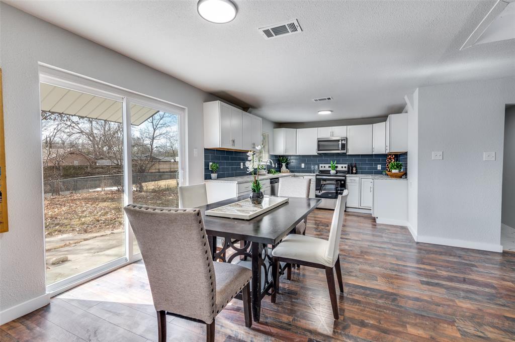 2314 Gilbert Circle Arlington, TX 76010 - Photo 6 of 25 a view of a dining room with furniture window and wooden floor