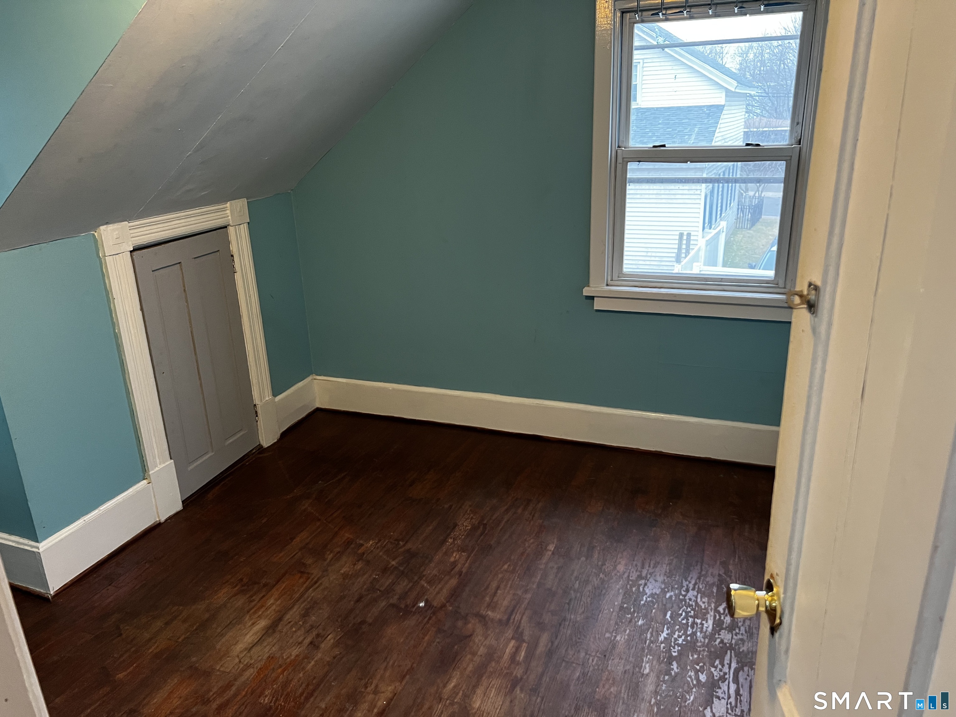 456 East Main Street Norwich, CT 06360 - Photo 13 of 23 a view of an empty room with wooden floor and a window