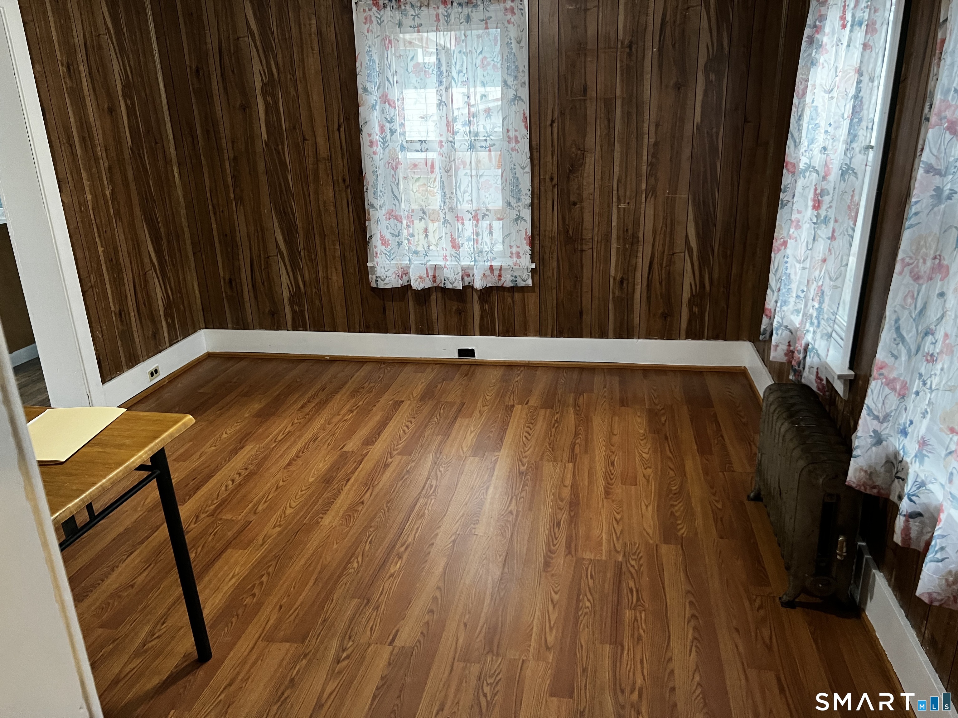 456 East Main Street Norwich, CT 06360 - Photo 21 of 23 a view of an empty room with wooden floor and a window
