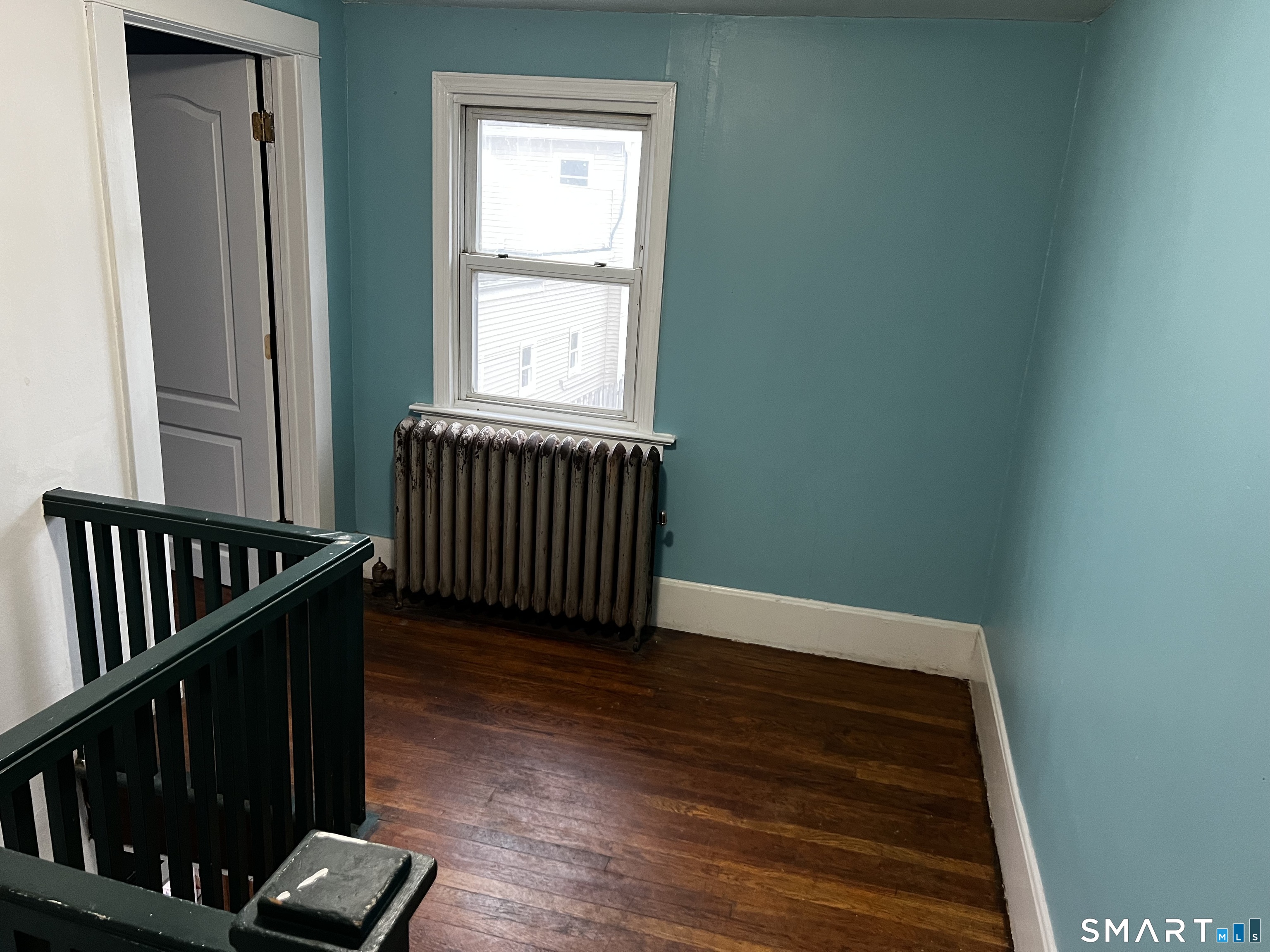 456 East Main Street Norwich, CT 06360 - Photo 23 of 23 a view of a hallway with wooden floor and a window