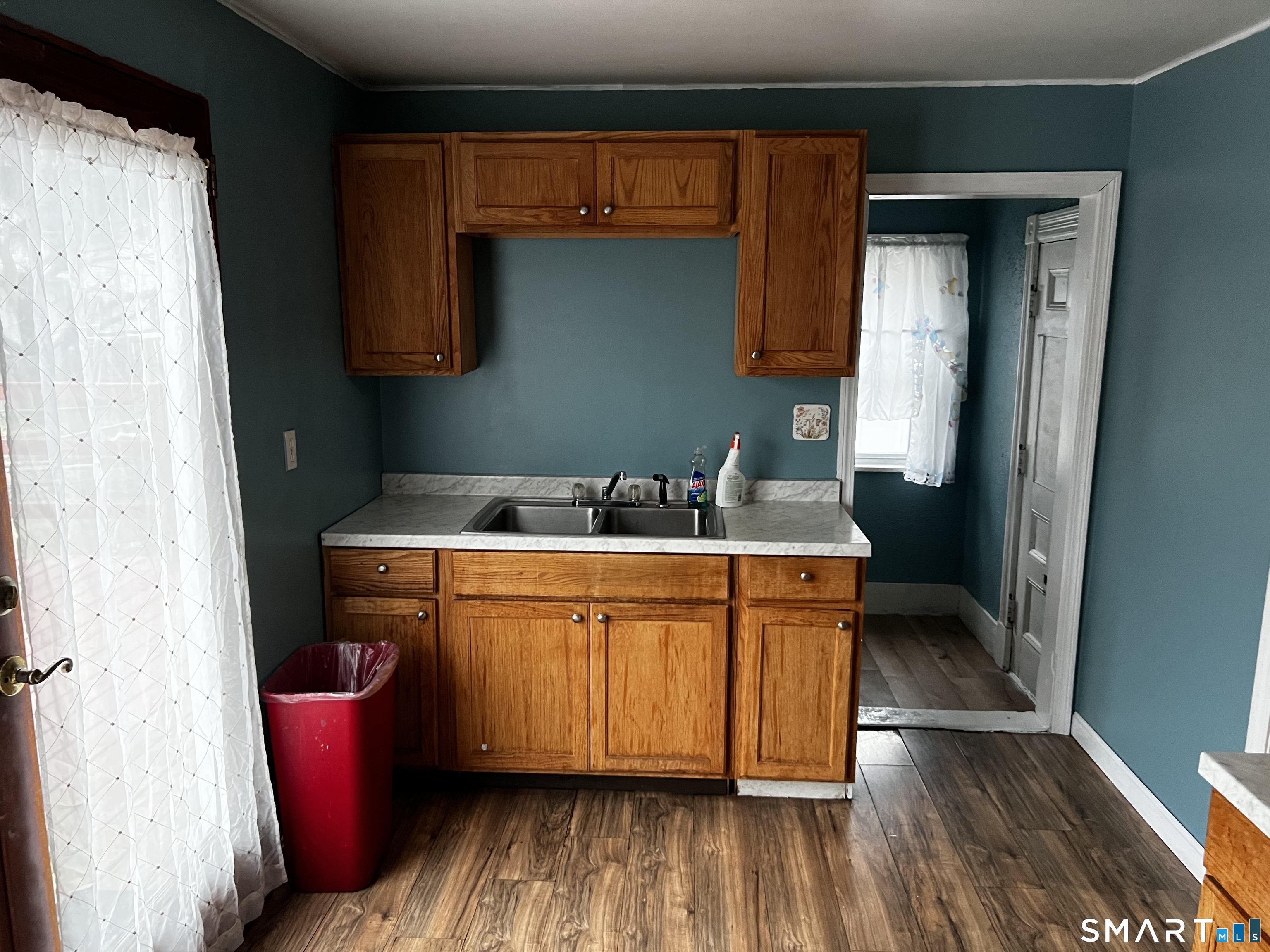 456 East Main Street Norwich, CT 06360 - Photo 5 of 23 a room with stainless steel appliances wooden floors sink and cabinets