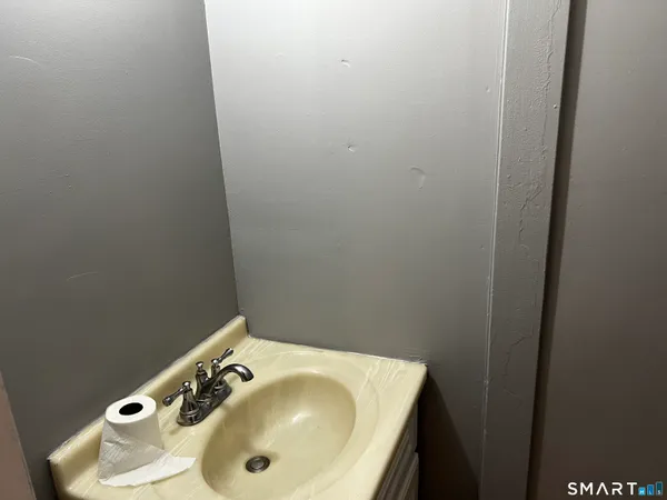 a bathroom with a sink and vanity