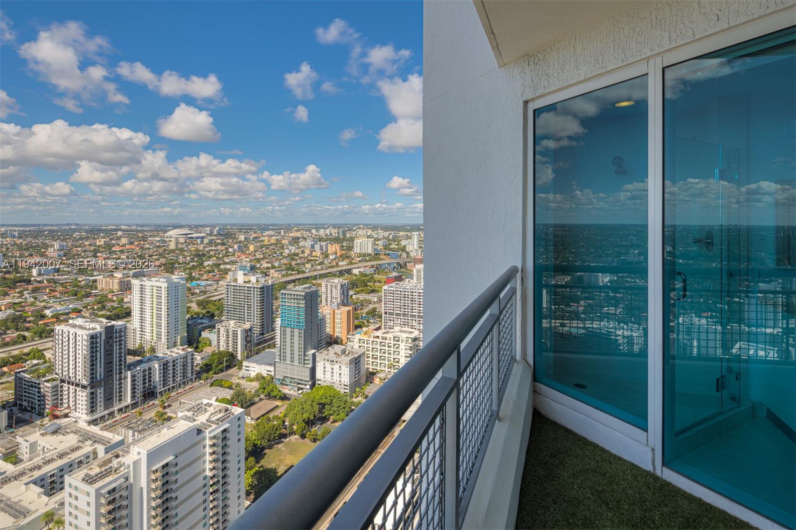 60 Southwest 13th Street, Unit 4211 Miami, FL 33130 - Photo 13 of 17 a view of a balcony with an ocean view