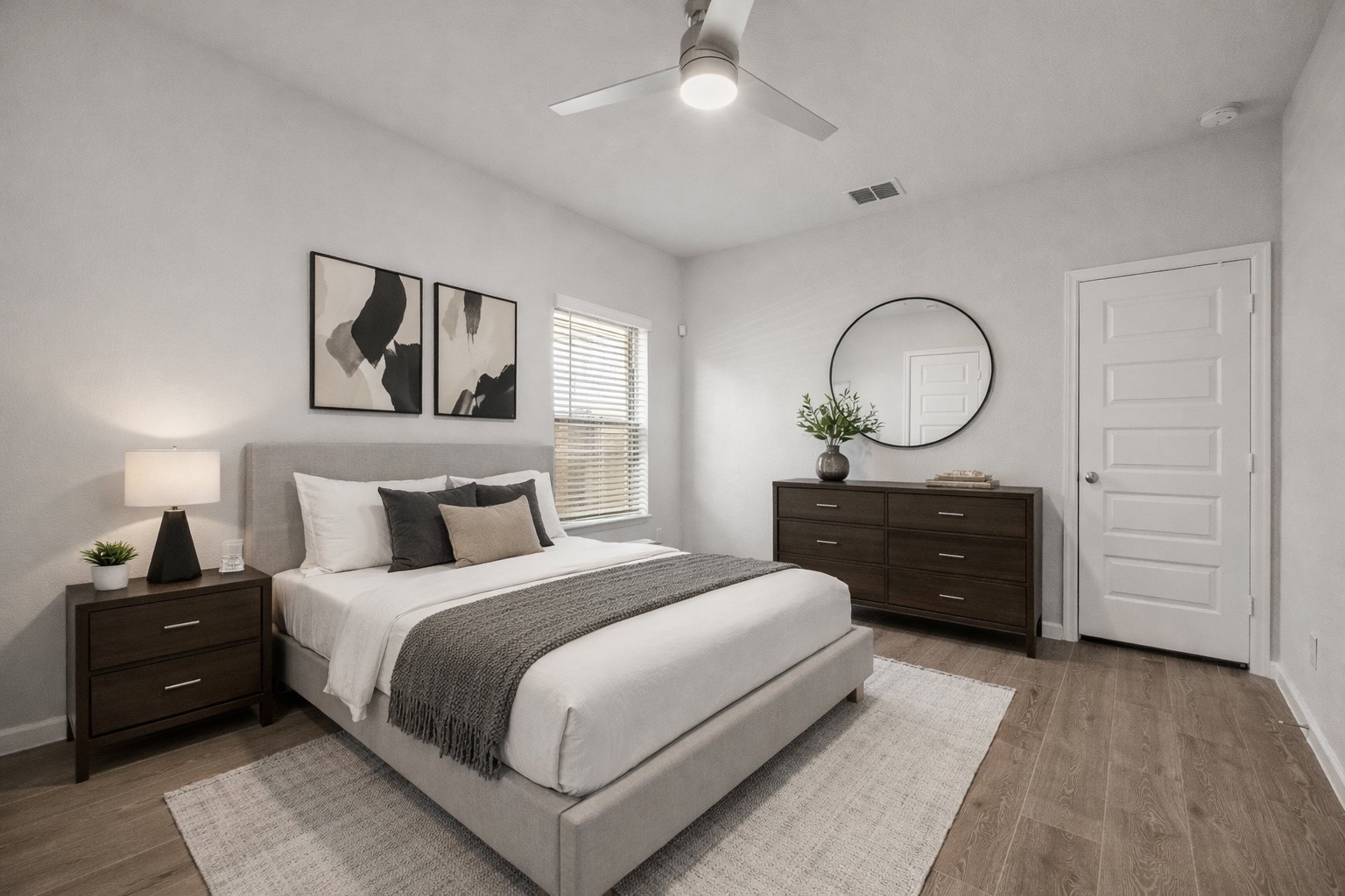 154 Amaranth Way Richmond, TX 77406 - Photo 16 of 37 a bedroom with a bed and a chandelier