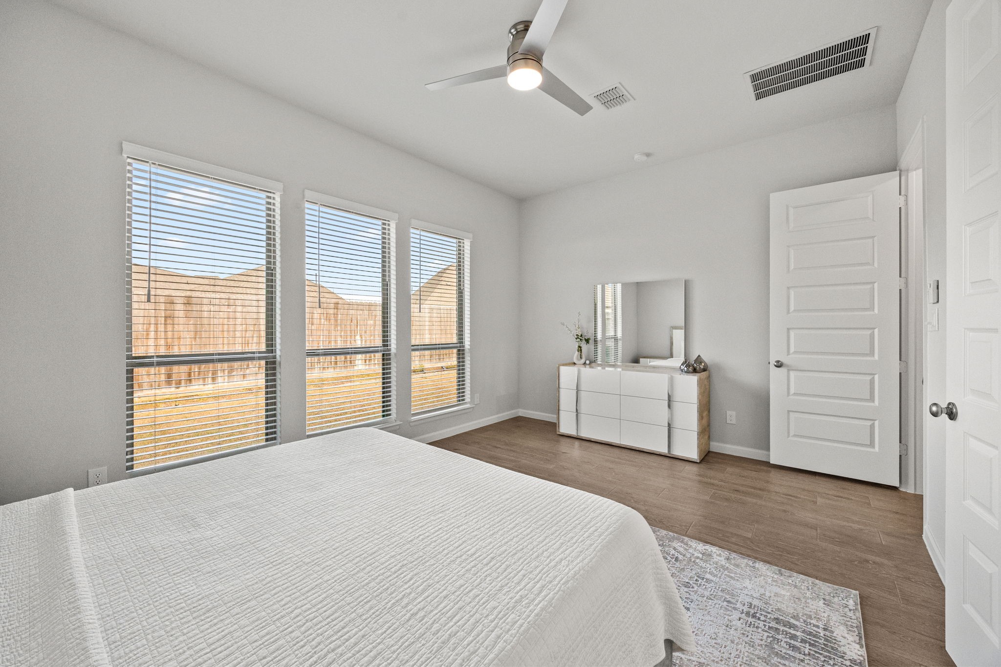154 Amaranth Way Richmond, TX 77406 - Photo 20 of 37 a bedroom with a large bed and a window
