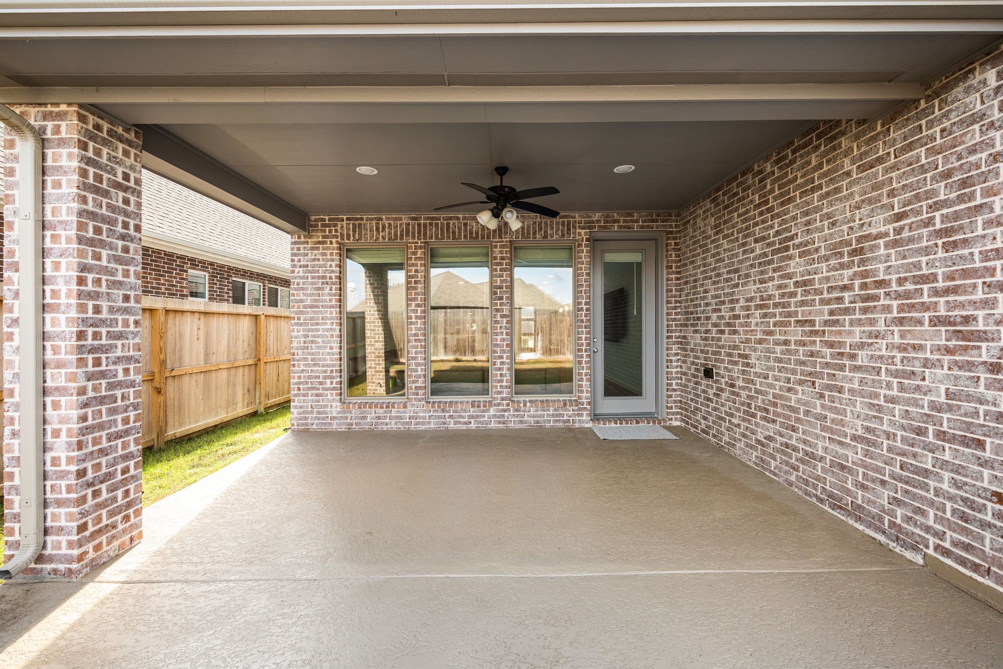 154 Amaranth Way Richmond, TX 77406 - Photo 35 of 37 Extended Covered Patio with spray decking