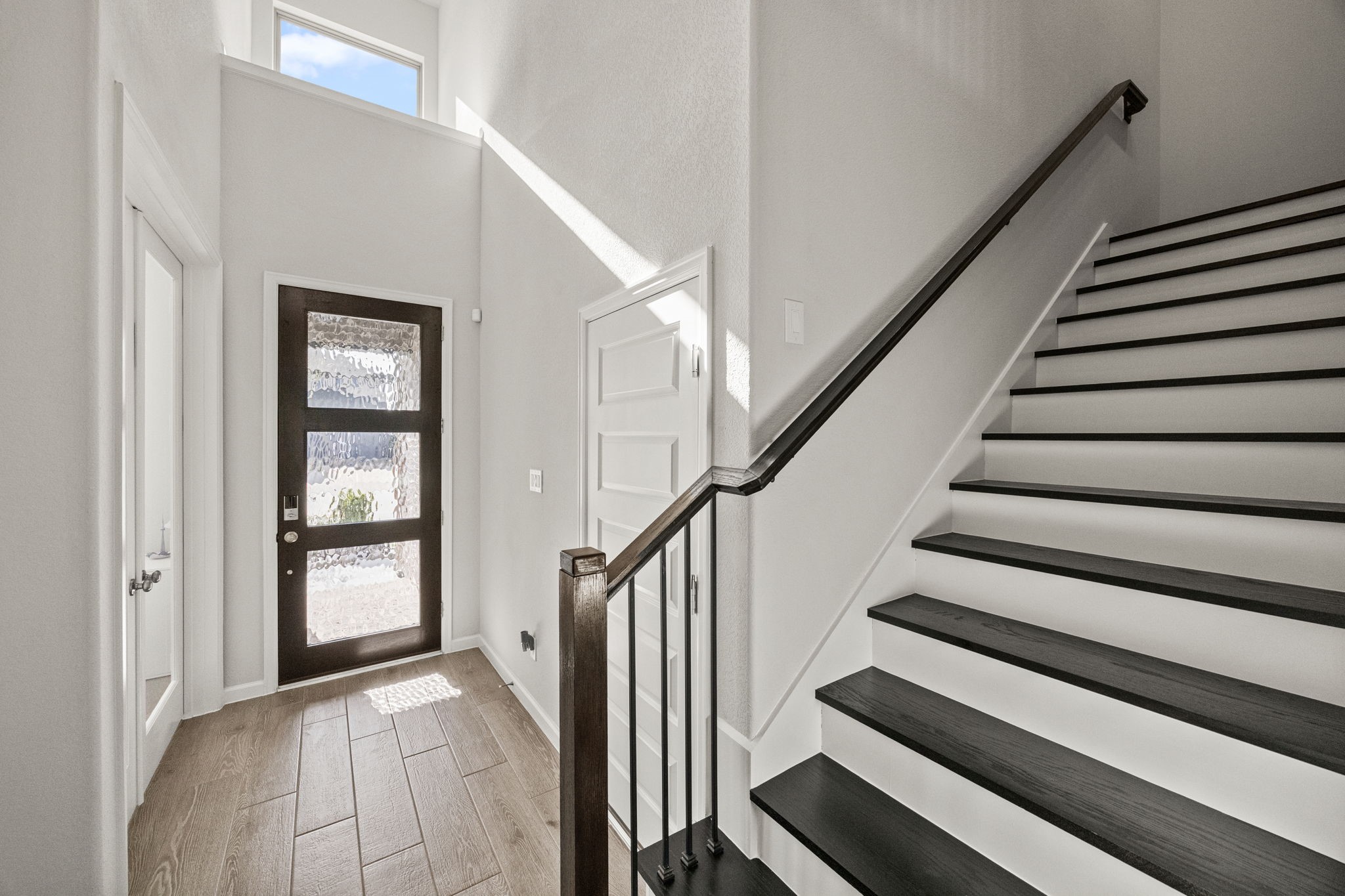 154 Amaranth Way Richmond, TX 77406 - Photo 6 of 37 a view of staircase with wooden floor and staircase