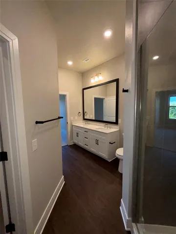 a bathroom with a shower and a toilet