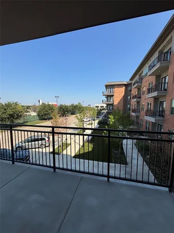 a view of a balcony with city view