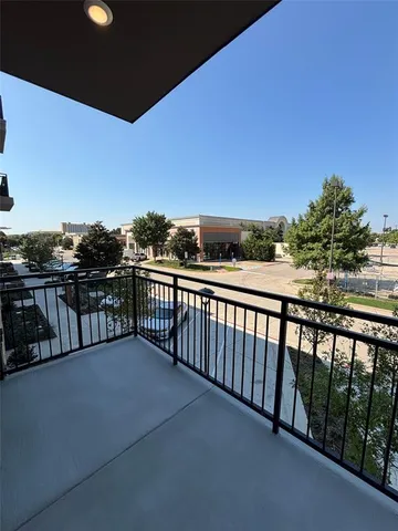 a view of balcony with furniture