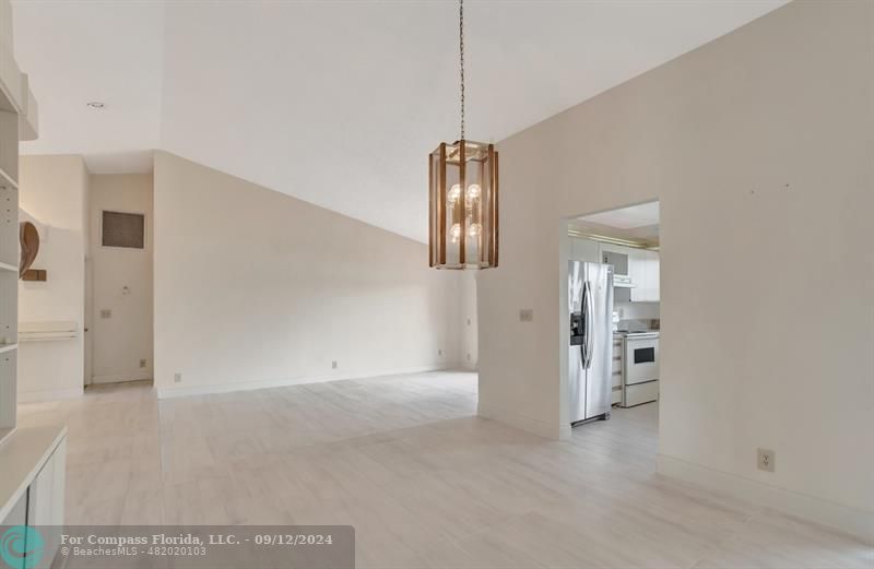 9477 Burlington Place Boca Raton, FL 33434 - Photo 13 of 40 a view of empty room with floor to ceiling window