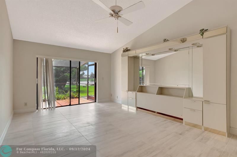 9477 Burlington Place Boca Raton, FL 33434 - Photo 18 of 40 a living room with furniture and a large window with outer view