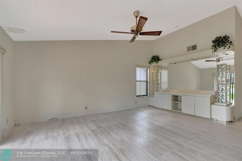 9477 Burlington Place Boca Raton, FL 33434 - Photo 21 of 40 wooden floor in an empty room with a window