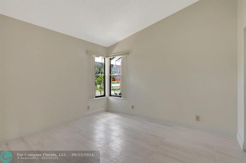 9477 Burlington Place Boca Raton, FL 33434 - Photo 30 of 40 an empty room with windows and closet