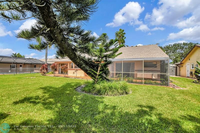 9477 Burlington Place Boca Raton, FL 33434 - Photo 34 of 40 a front view of a house with a yard