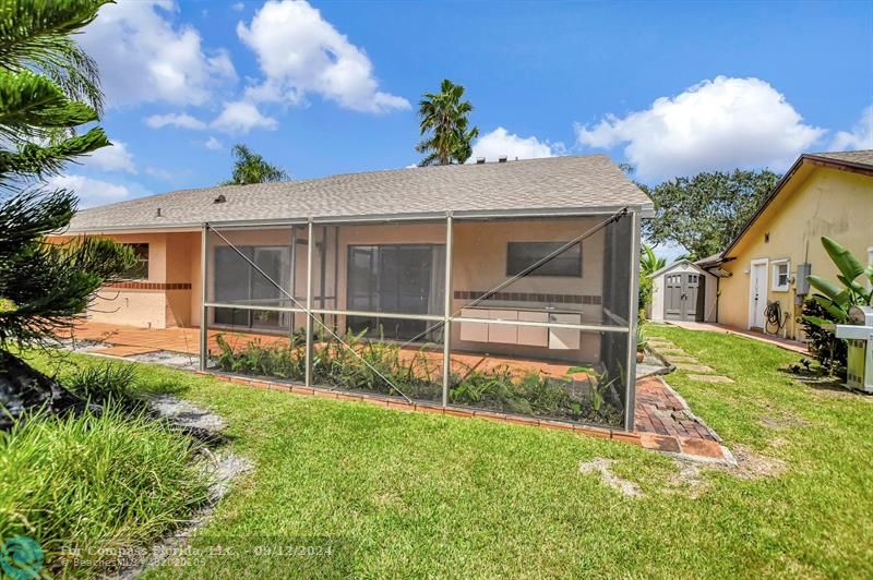 9477 Burlington Place Boca Raton, FL 33434 - Photo 35 of 40 a view of a back yard of the house
