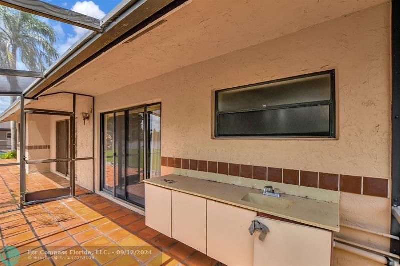9477 Burlington Place Boca Raton, FL 33434 - Photo 38 of 40 a bathroom with a sink a large mirror and a shower