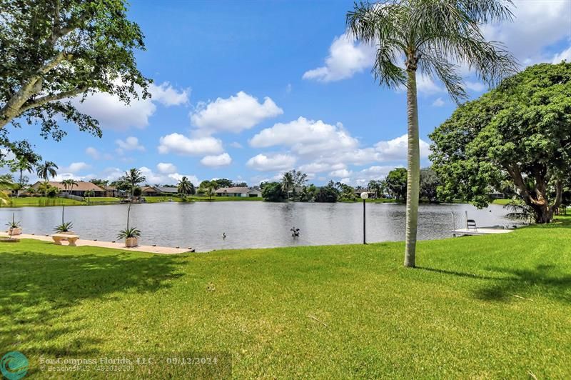 9477 Burlington Place Boca Raton, FL 33434 - Photo 5 of 40 a view of a lake with houses in the back