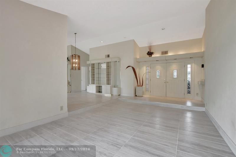 9477 Burlington Place Boca Raton, FL 33434 - Photo 10 of 40 a view of a livingroom with wooden floor and a large window