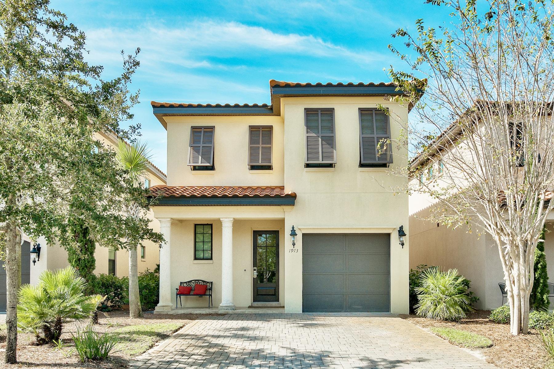 1973 Baytowne Loop Miramar Beach, FL 32550 - Photo 1 of 40 a view of a white house with a potted plant and a large tree